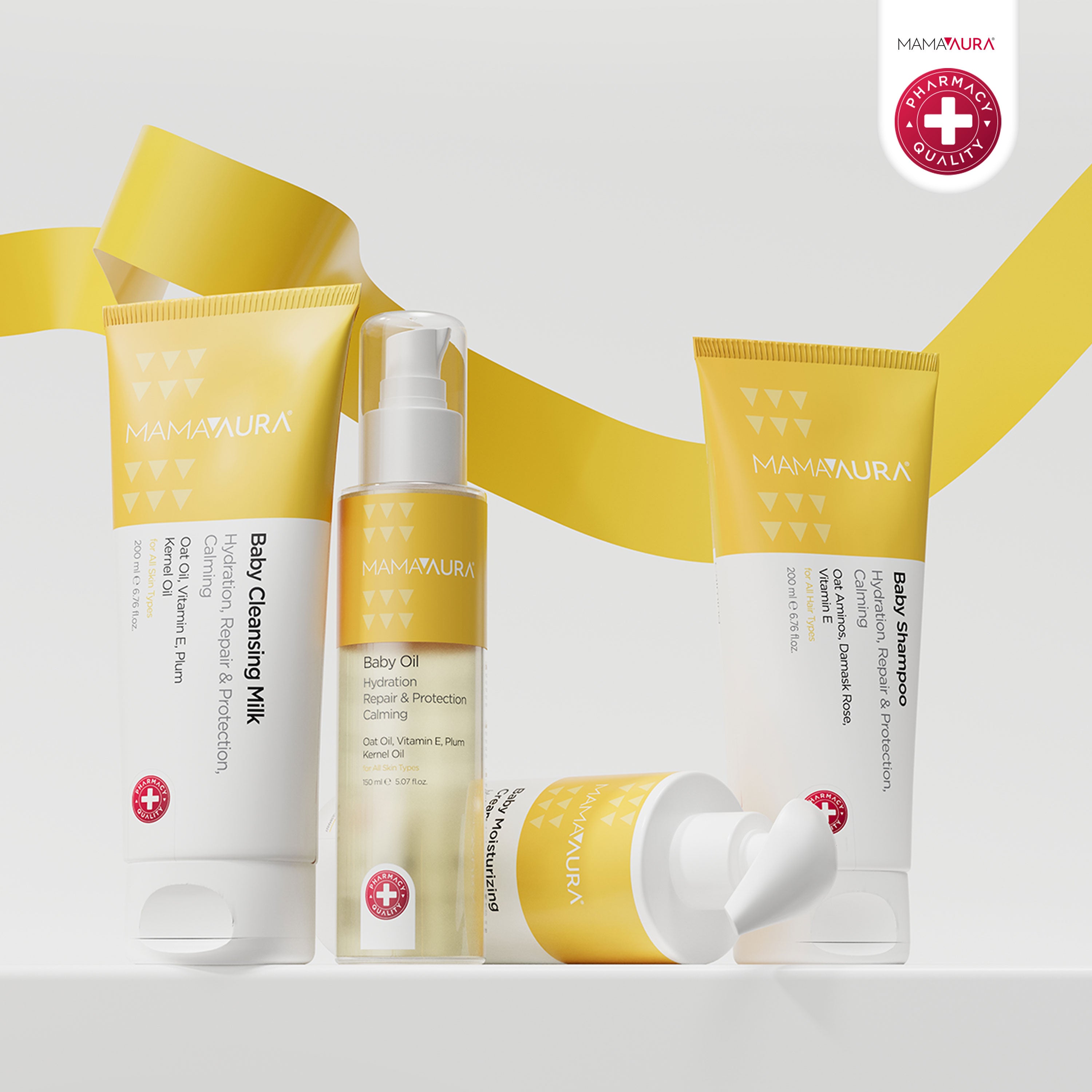Baby Cleansing Milk, Baby Oil, Baby Shampoo ve Baby Moisturizing Cream altın sarısı kurdeleli arka planda birlikte, Vitamin E ve Yulaf içerikli doğal ve nazik tam bebek cilt bakım seti